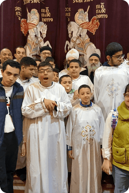 Children with disabilities and clergy at a community gathering.