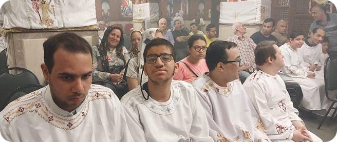 Young men with disabilities at a church service.